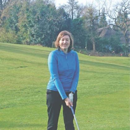 Carol with golf club