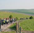 Trekkers with hills and fields in the background