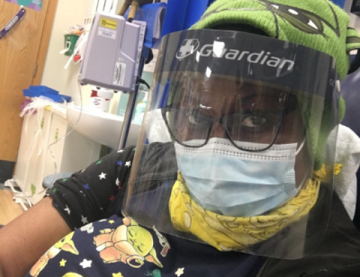 Miranda wearing a face mask and visor while receiving treatment during the Covid-19 pandemic.