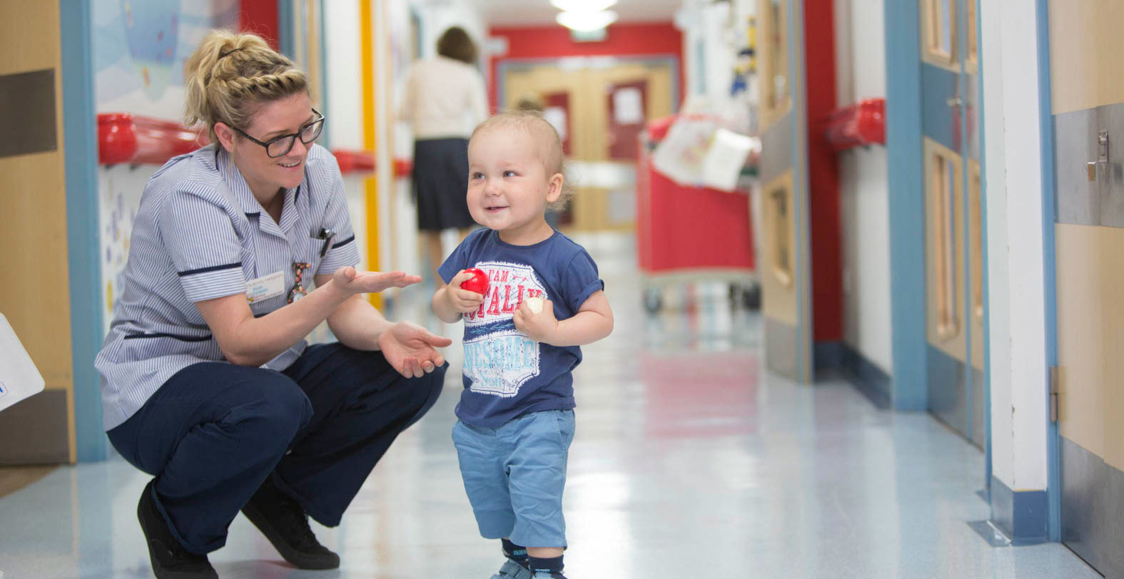 A young patient playing with Staff Nurse