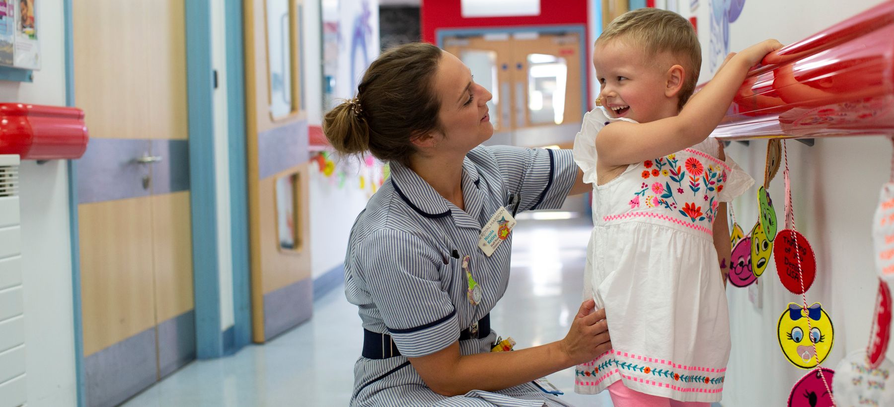 Patient Elodie Macey with a nurse