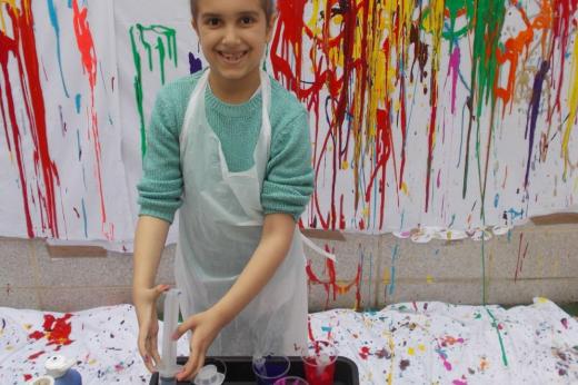 Young patient plays with paint syringes