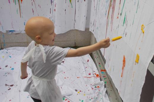 Patient playing with paint syringe