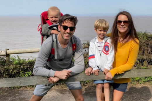 Image of Natalie enjoying a day out with her husband and two sons.