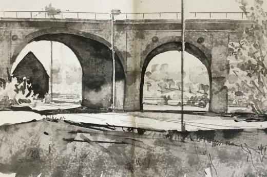 Landscape painted in black ink showing an arched bridge 