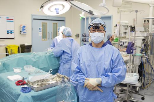 Mr Gui wearing scrubs photographed in theatre for a breast surgery