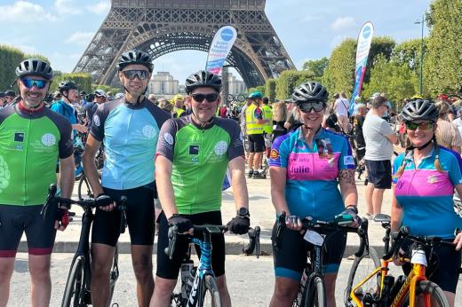 Chief Operating Officer Karl Munslow Ong, Chief Financial Officer Marcus Thorman and Medical Director Professor Nicholas Van As, and Patients Julie and Jackie in front of the Eiffel tower with their bikes.