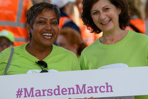 Two ladies holding Marsden March banner