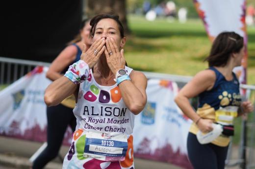 Runner Alison blows a kiss at the camera whilst taking on the Royal Parks Half Marathon