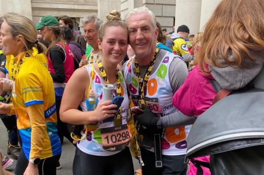 Two Team Marsden runners smile at the camera with their medals after London Landmarks Half Marathon