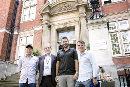 Four people standing outside the front steps of The Royal Marsden Chelsea hospital