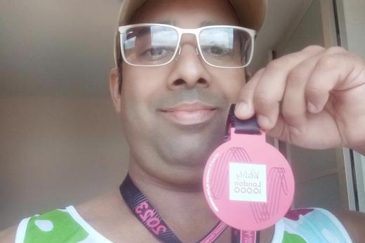 Team Marsden runner at home with his Vitality 10K 2023 medal