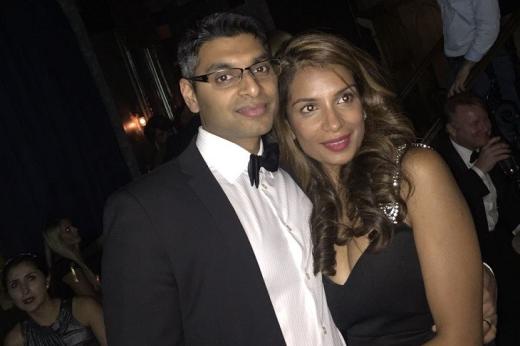 Royal Marsden patient Sara with her husband at a formal event, they are both dressed smartly. Sara is wearing a black dress with curled hair and her husband is in a black suit and bowtie.