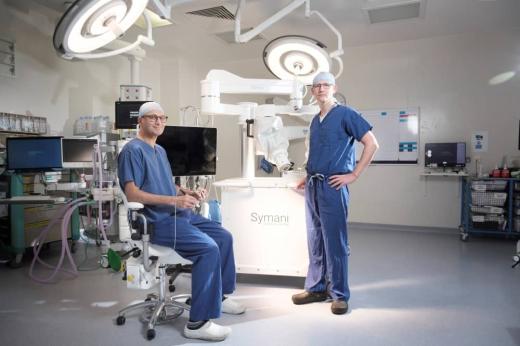 Kieran Power, Head of Plastic Surgery, and Aadil Khan, Consultant Plastic Surgeon with the new Symani Surgical System for microsurgery procedures at The Royal Marsden