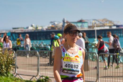 Royal Marsden runner with Brighton pier, the sea and people in the background