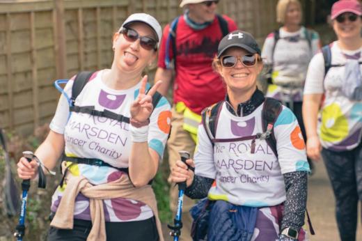 RMCC trekkers in their hiking gear and walking poles smiling at the camera