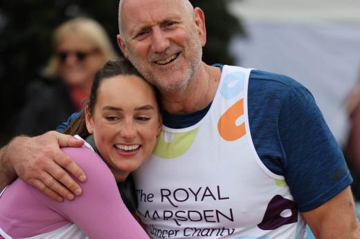 RMCC runners embracing and smiling at the camera