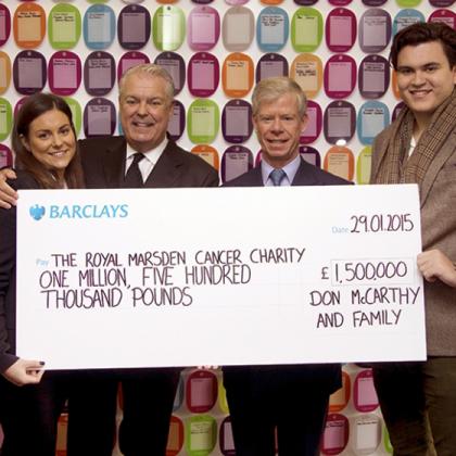 Don McCarthy and family present giant cheque to Ian Molson
