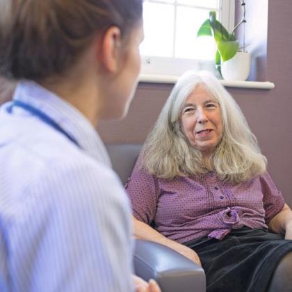 Patient Margaret Perkins with a nurse