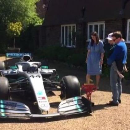 Harry and his parents with F1 car