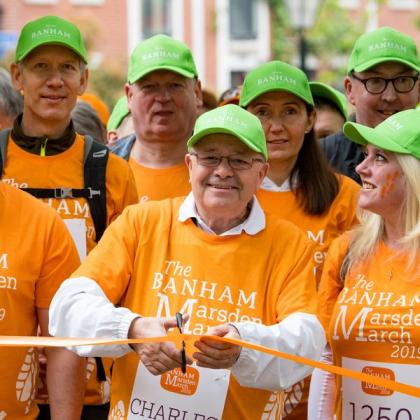 Charles Hallatt cutting the ribbon at The Banham Marsden March