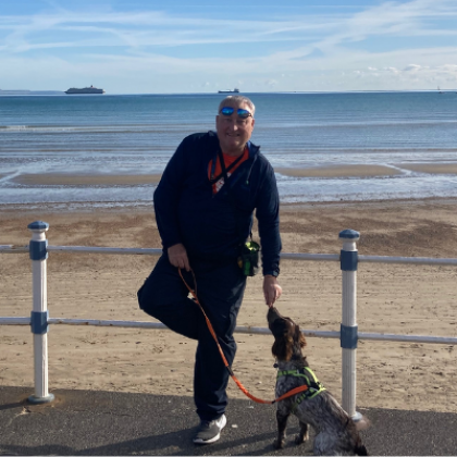 Malcolm Pearce at the beach with his dog