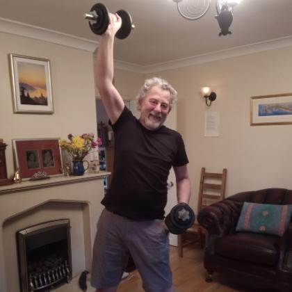 Patient David exercising in his house