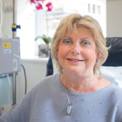 Photo of Christine smiling.