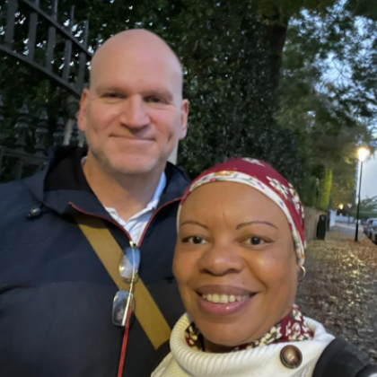 Photo of Debbie and her partner Dan smiling