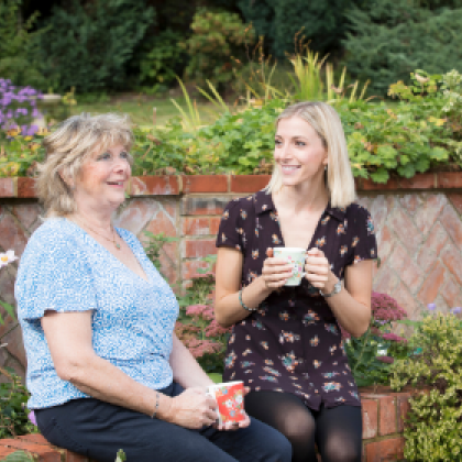 Photo of Christine and Stephanie chatting in the garden