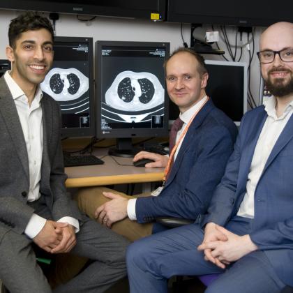 Dr Sumeet Hindocha, Dr Richard Lee and Dr Benjamin Hunter looking at scans on a computer