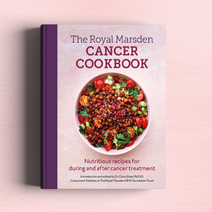 The pink front cover of The Royal Marsden Cancer Cookbook, which shows an image of a healthy salad meal with chickpeas, tomatoes and salad leaves.