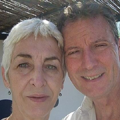 Michael and Pip in a sunny setting under a canope