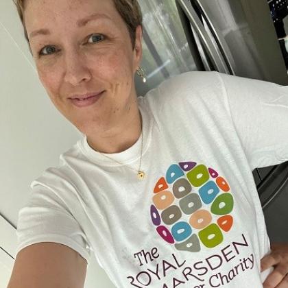 Headshot of a person smiling in a Royal Marsden Cancer Charity t-shirt