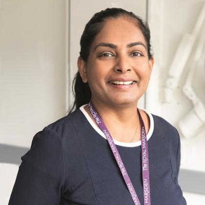 Head and shoulders of a doctor, she is wearing a smart blue top and a purple Royal Marsden lanyard