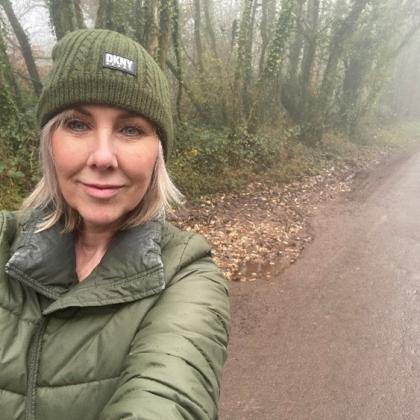 Julie walking through the forest