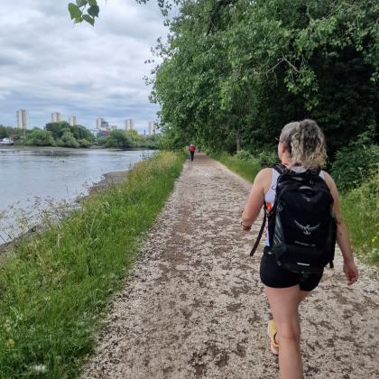 Person walking along the Thames Path