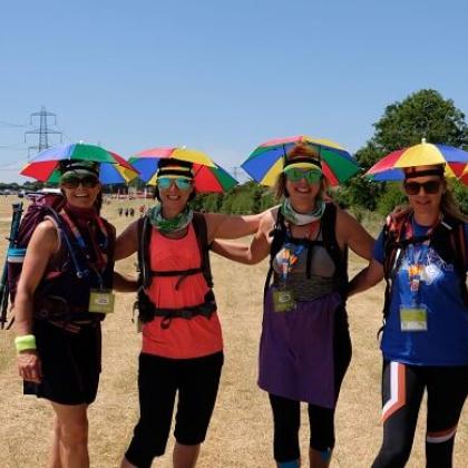 Bath 50 Challenge walkers with umbrella hats
