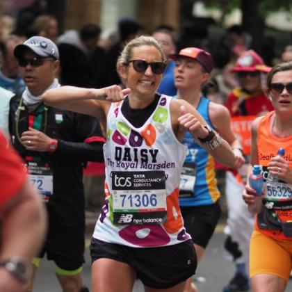 Team Marsden runner smiling and giving two thumbs up to the camera