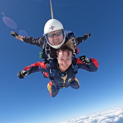 Person smiling as they take on a charity skydive