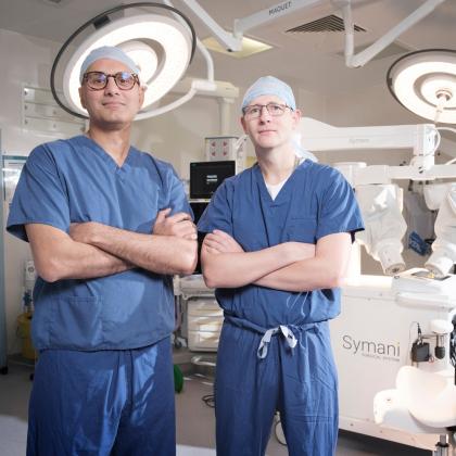 Aadil Khan and Kieran Power with the the Symani® Surgical System