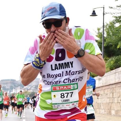 Royal Marsden runner blowing a kiss to camera while running