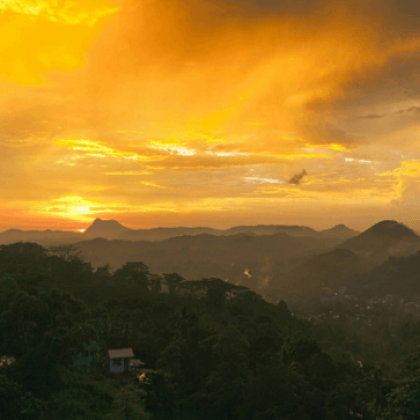 Mountain scenery on an overseas cycle, with orange sunset and clouds