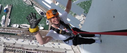 One of our supporters waves as she abseils down the Spinnaker Tower