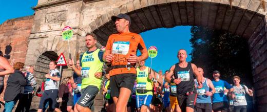 Chester marathon runners running through town