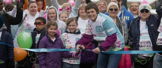 Joanne Jones cutting the ribbon at the start of the Marsden March