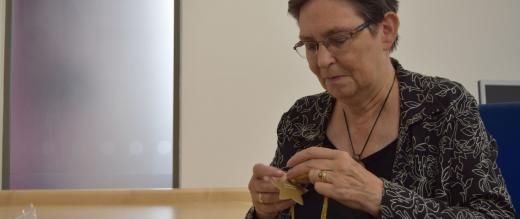 Mary stringing the stars for the tree