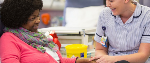 lady smiling with nurse