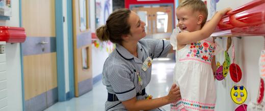 Patient Elodie Macey with a nurse