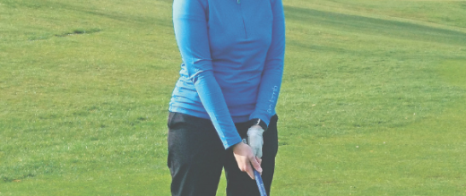 Carol playing golf